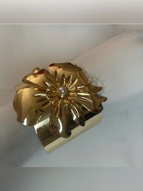 Gold tone metallic flower cuff bracelet